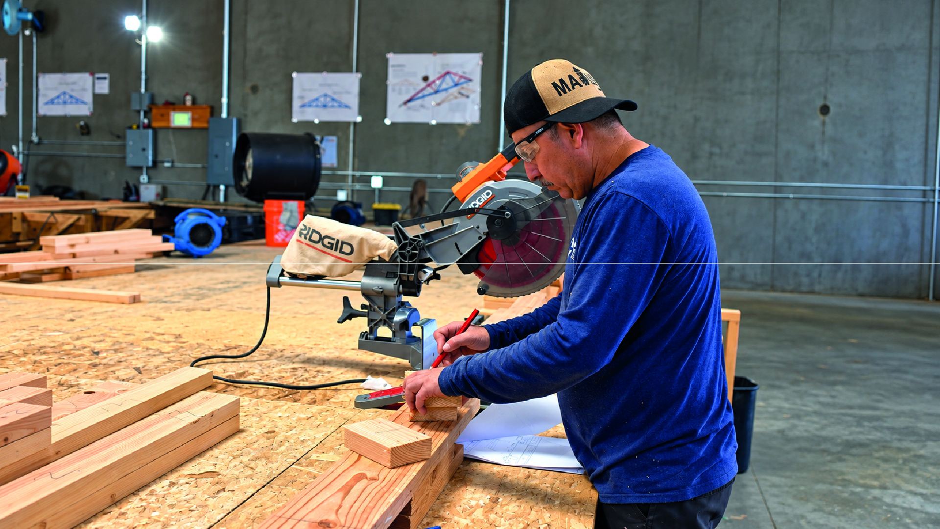 Omega team member cutting truss lumber in the Thousand Palms facility